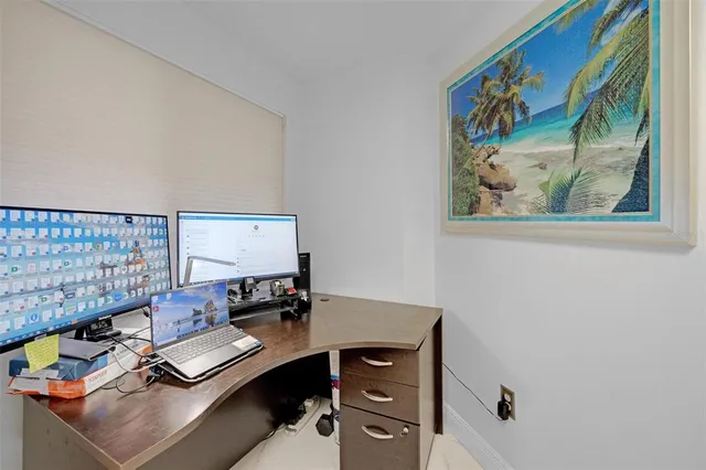 a view of a workspace with furniture