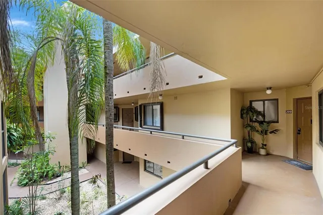 a view of a back yard from a balcony