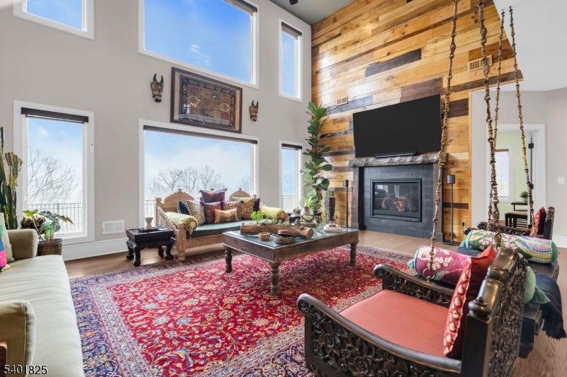 846 Sunset Ridge Bridgewater, NJ 08807 - Photo 14 of 50 a living room with furniture a fireplace and a flat screen tv