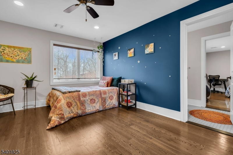 846 Sunset Ridge Bridgewater, NJ 08807 - Photo 34 of 50 a bedroom with a bed and wooden floor