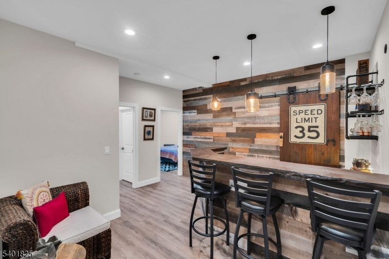 846 Sunset Ridge Bridgewater, NJ 08807 - Photo 38 of 50 a kitchen with stainless steel appliances kitchen island granite countertop a dining table chairs and a refrigerator