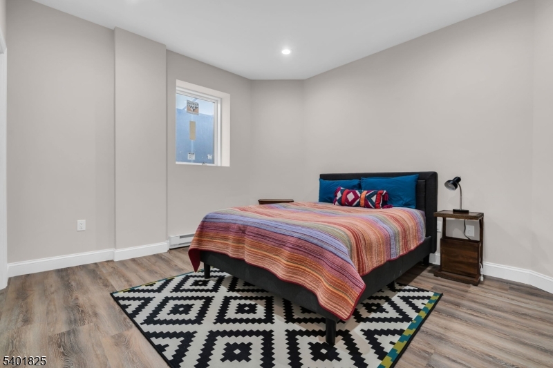 846 Sunset Ridge Bridgewater, NJ 08807 - Photo 39 of 50 a bedroom with a bed and wooden floor