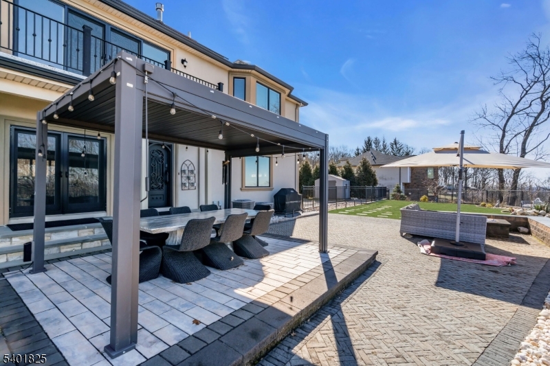 846 Sunset Ridge Bridgewater, NJ 08807 - Photo 48 of 50 a view of a patio with couches and table and chairs with wooden floor