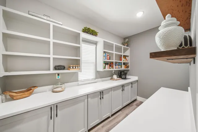 a kitchen with a sink and a wooden cabinets