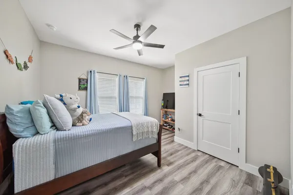 a bedroom with a bed and window