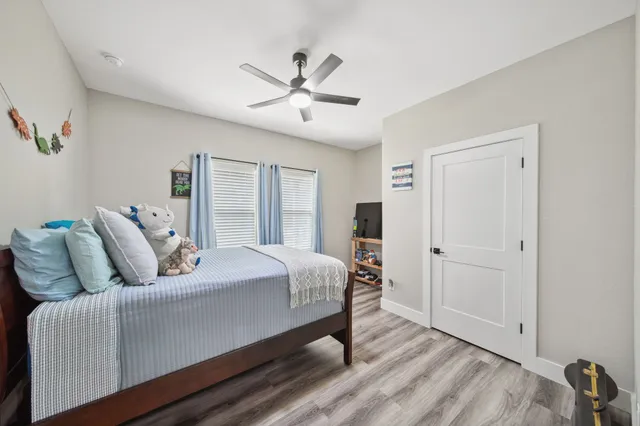 a bedroom with a bed and window