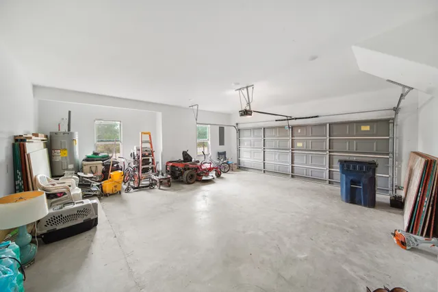 a view of a livingroom with furniture and a garage