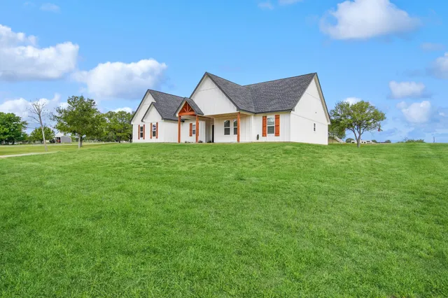 a view of swimming pool with a yard and outdoor seating