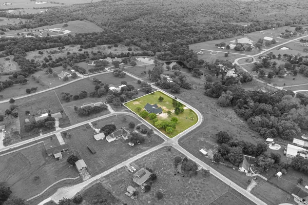a view of a swimming pool with a yard