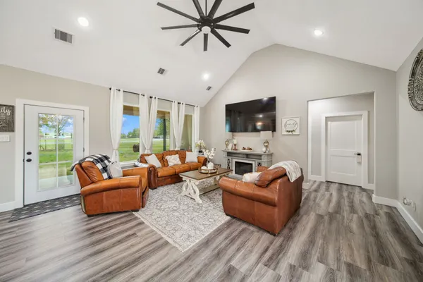 a living room with furniture and a flat screen tv