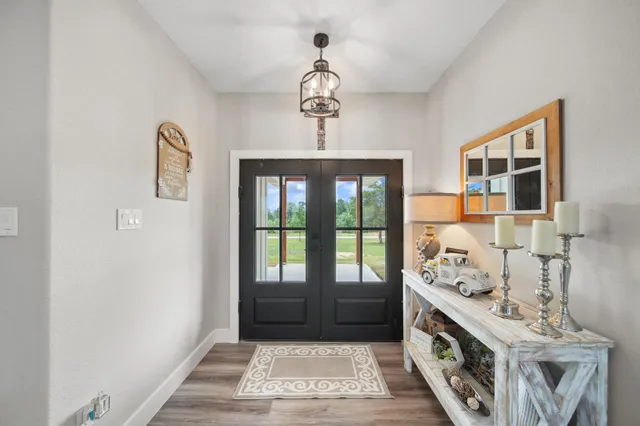 a view of hallway with chandelier