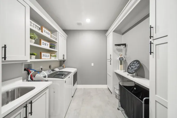 a kitchen with a sink cabinets and window
