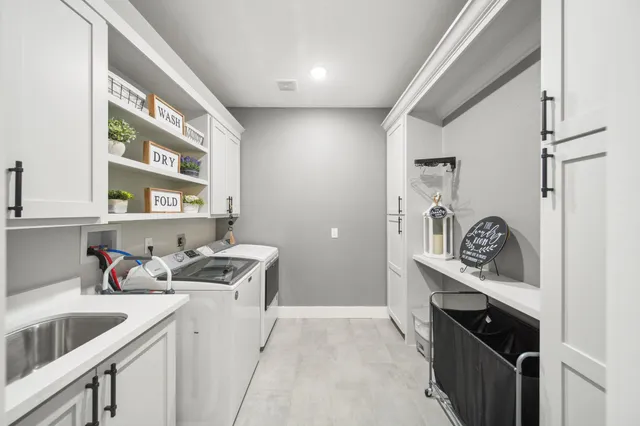 a kitchen with a sink cabinets and window