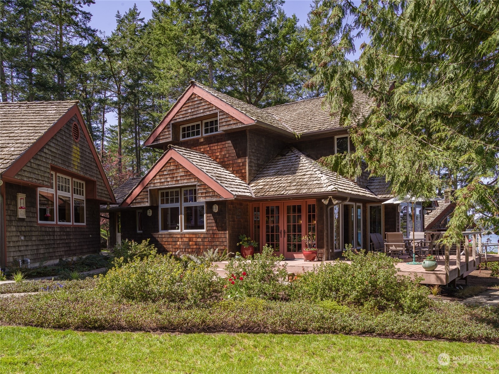 777 Eliza Road Lopez Island, WA 98261 - Photo 1 of 38 a front view of a house with a yard