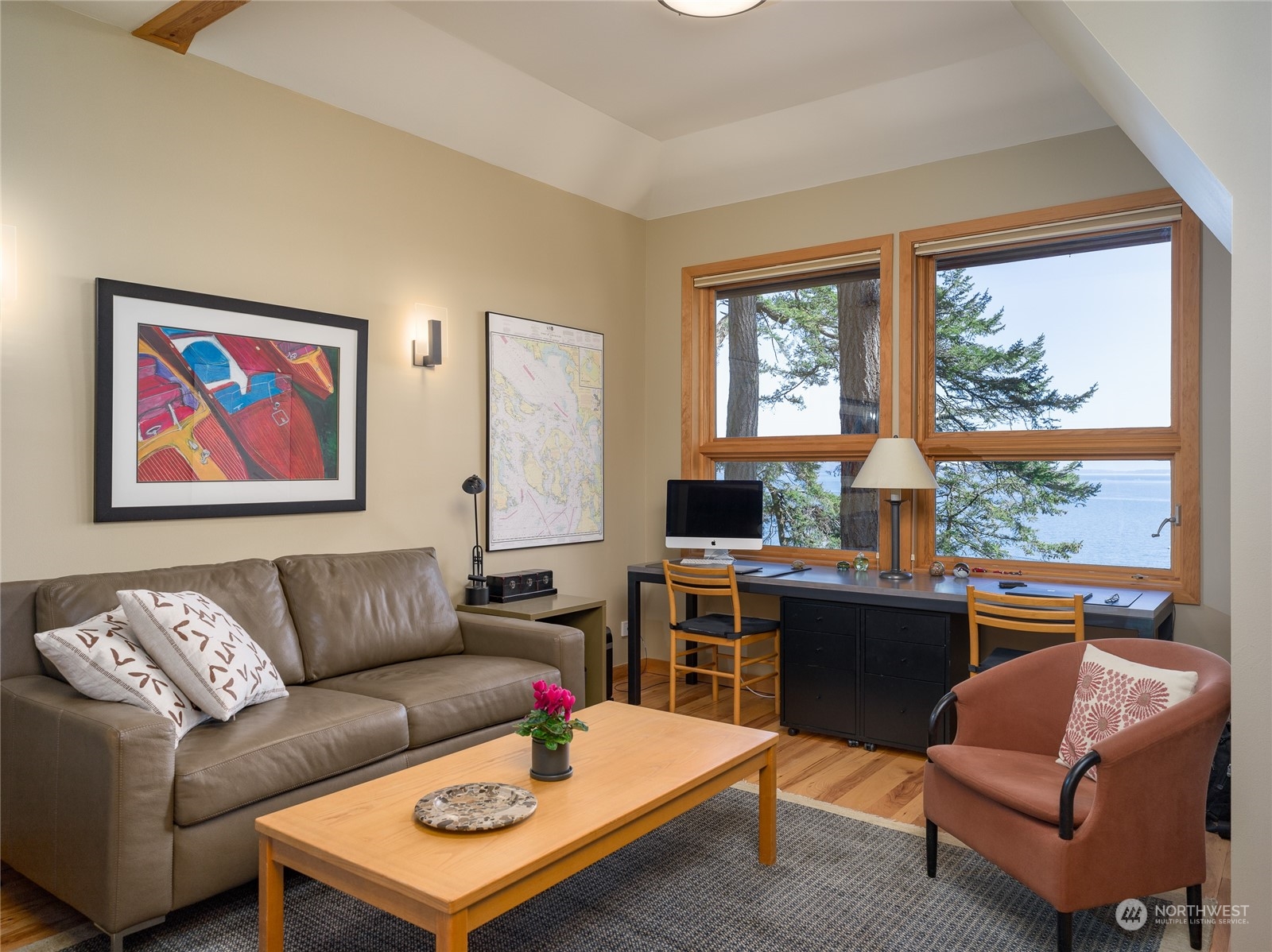 777 Eliza Road Lopez Island, WA 98261 - Photo 14 of 38 a living room with furniture a flat screen tv and a window