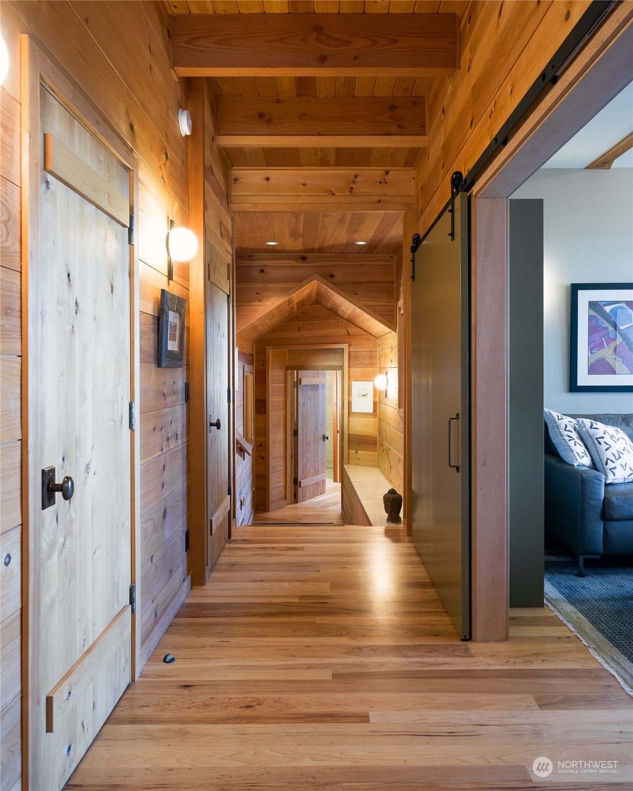 777 Eliza Road Lopez Island, WA 98261 - Photo 17 of 38 a view of a hallway with wooden floor and staircase
