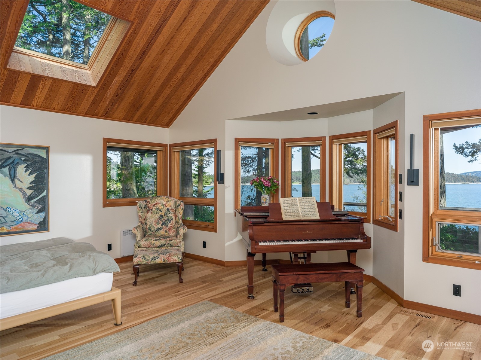 777 Eliza Road Lopez Island, WA 98261 - Photo 18 of 38 a living room with furniture a rug and a large window