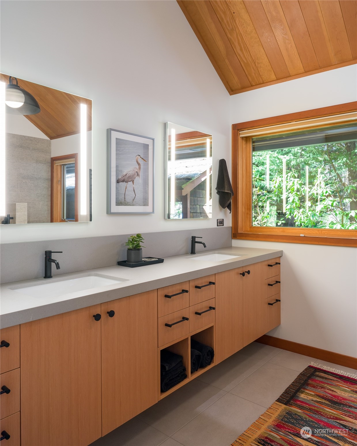 777 Eliza Road Lopez Island, WA 98261 - Photo 20 of 38 a spacious bathroom with double vanity and a large window