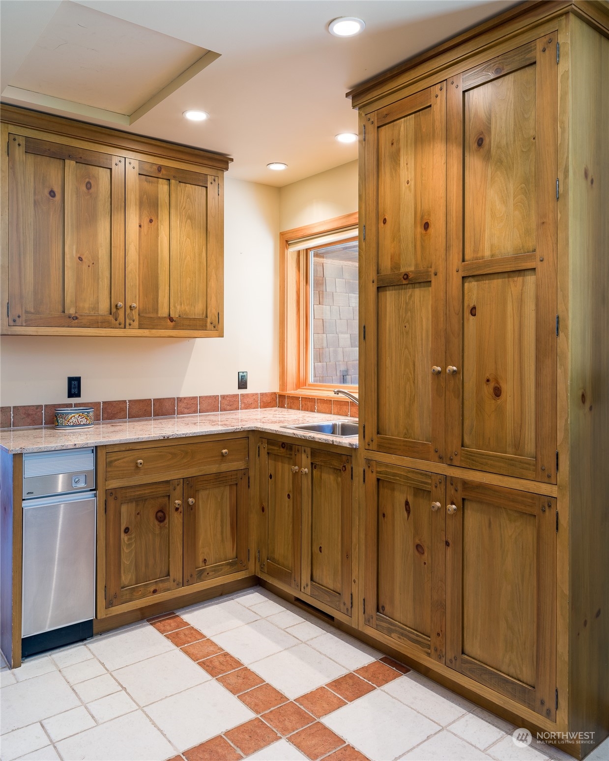 777 Eliza Road Lopez Island, WA 98261 - Photo 27 of 38 a kitchen with stainless steel appliances granite countertop a sink and cabinets