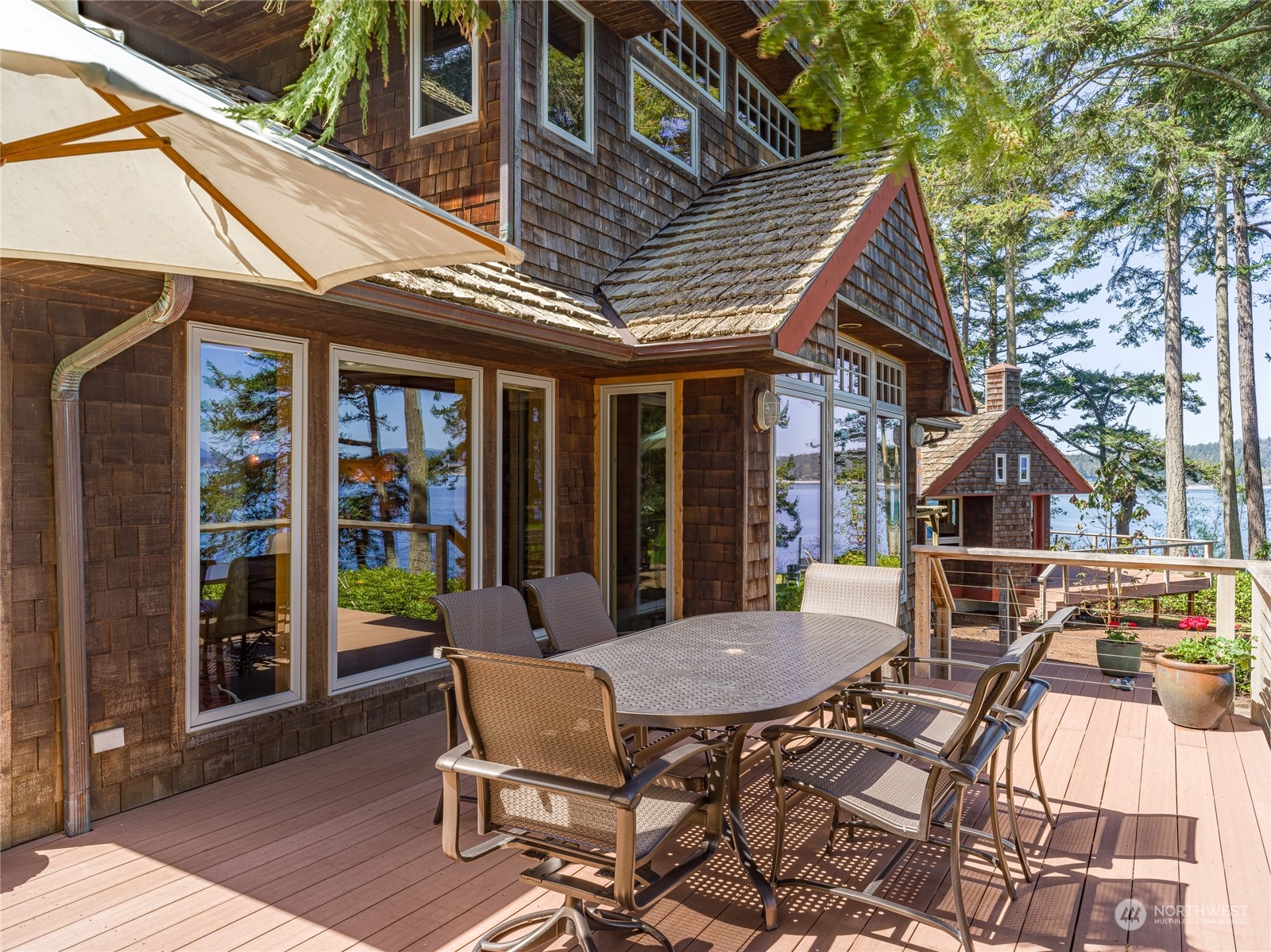 777 Eliza Road Lopez Island, WA 98261 - Photo 30 of 38 a view of a patio with table and chairs and potted plants