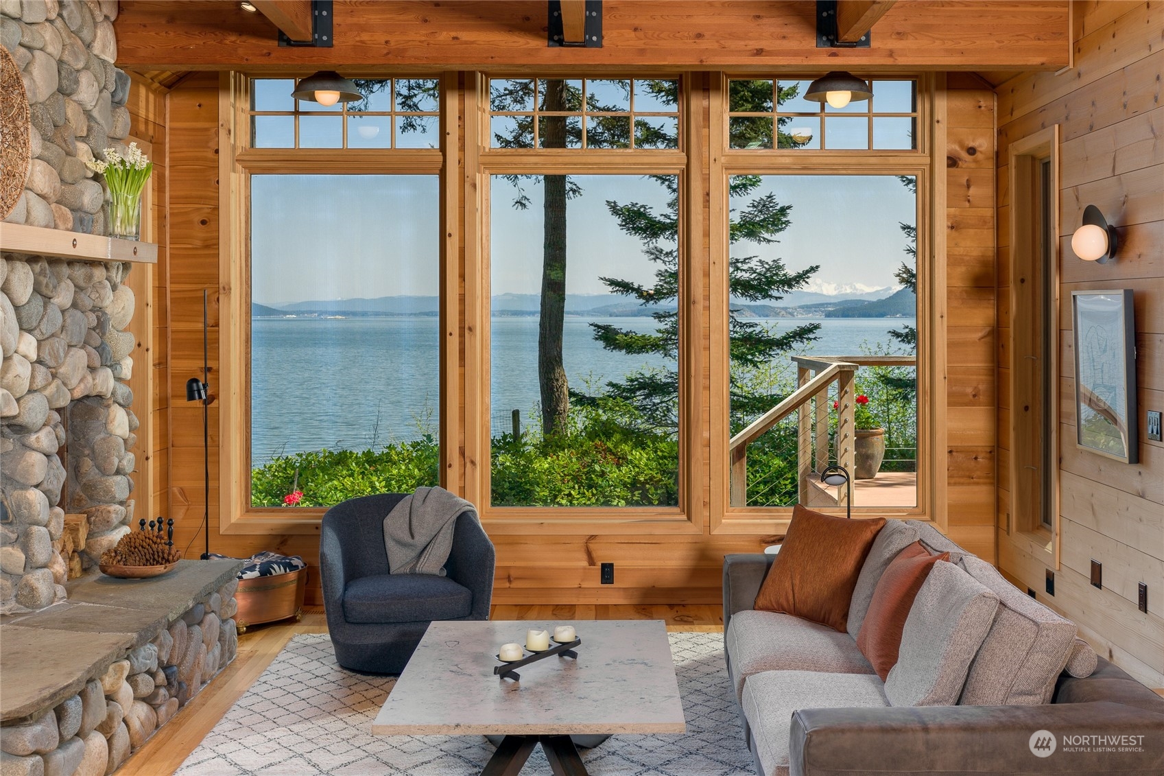 777 Eliza Road Lopez Island, WA 98261 - Photo 7 of 38 a view of a patio with couches and potted plants