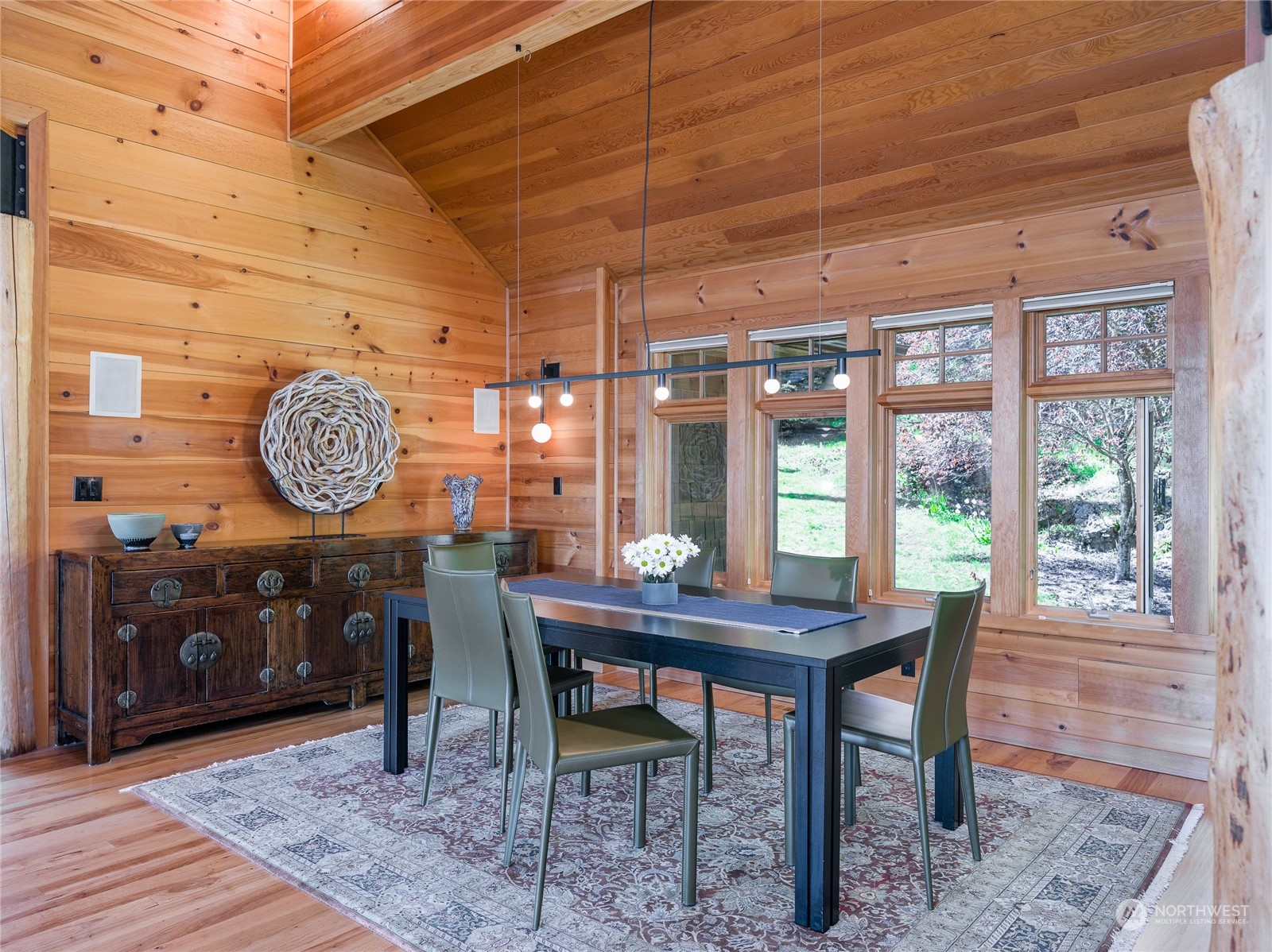 777 Eliza Road Lopez Island, WA 98261 - Photo 9 of 38 a view of a dining room with furniture window and wooden floor