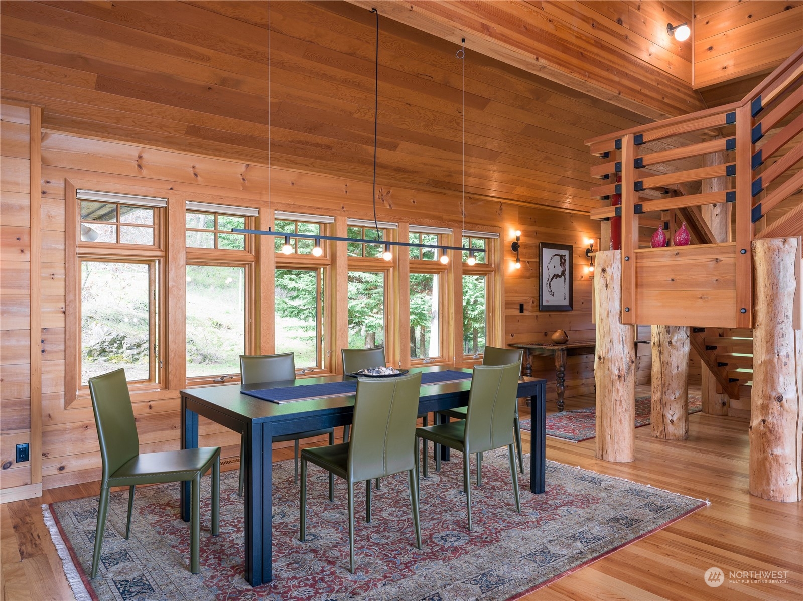 777 Eliza Road Lopez Island, WA 98261 - Photo 10 of 38 a view of a dining room with furniture window and wooden floor
