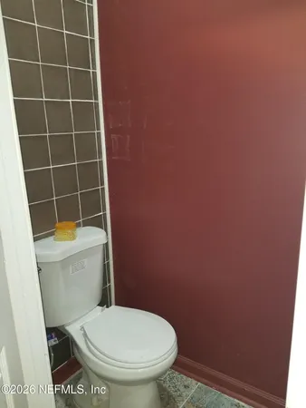 an entryway with a rug