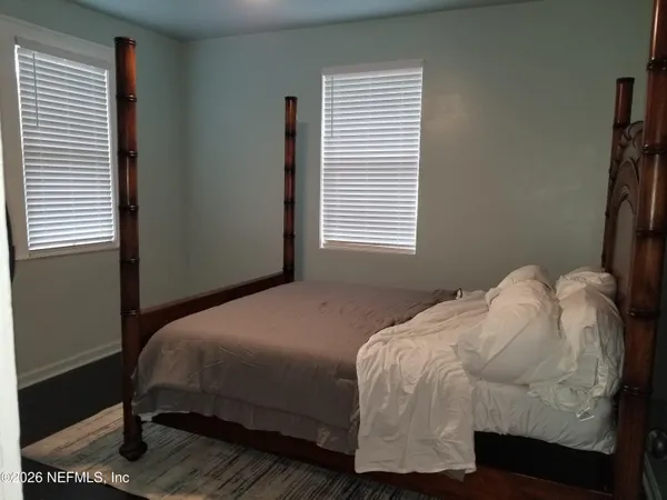 a living room with a toilet and a table