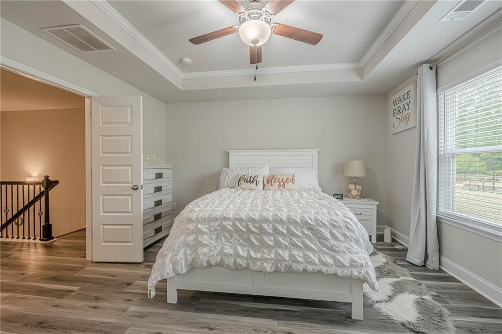 6940 Cedar Glen Road Atlanta, GA 30360 - Photo 13 of 24 a bedroom with a bed and a window
