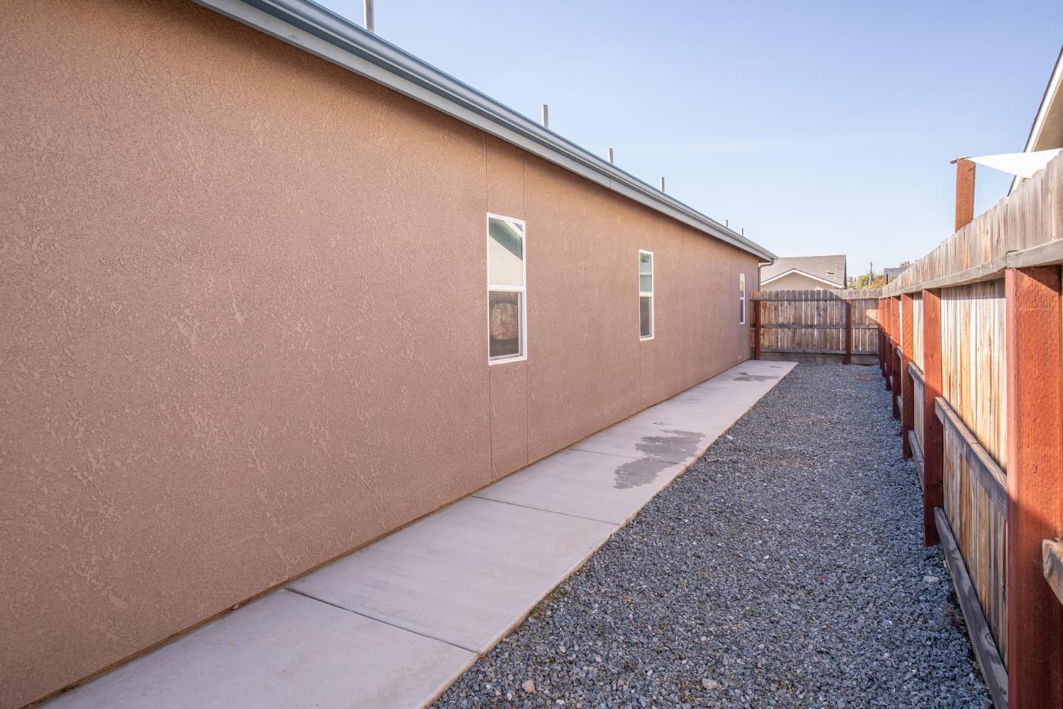 1374 South Enns Avenue Reedley, CA 93654 - Photo 41 of 48 a hallway with stairs