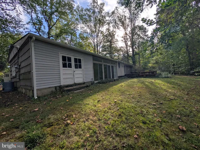 a view of a backyard of the house