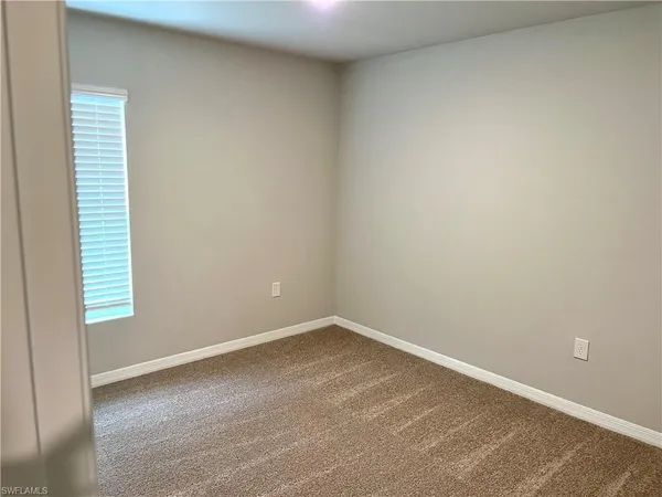 a bathroom with a bathtub and a toilet