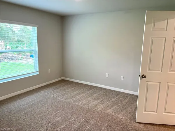 a white toilet sitting next to a bath tub