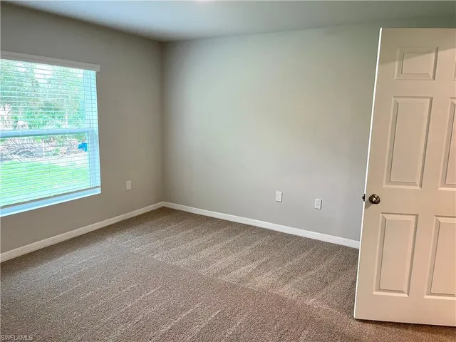 a white toilet sitting next to a bath tub