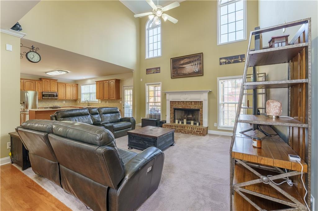 976 Redstone Road Dacula, GA 30019 - Photo 11 of 43 a living room with furniture and a fireplace