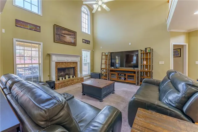 a view of an entryway with wooden floor and a livingroom