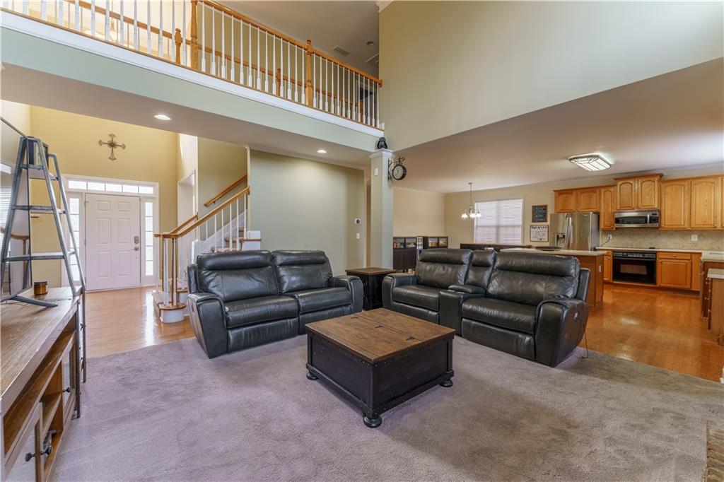 976 Redstone Road Dacula, GA 30019 - Photo 14 of 43 a living room with furniture and kitchen view