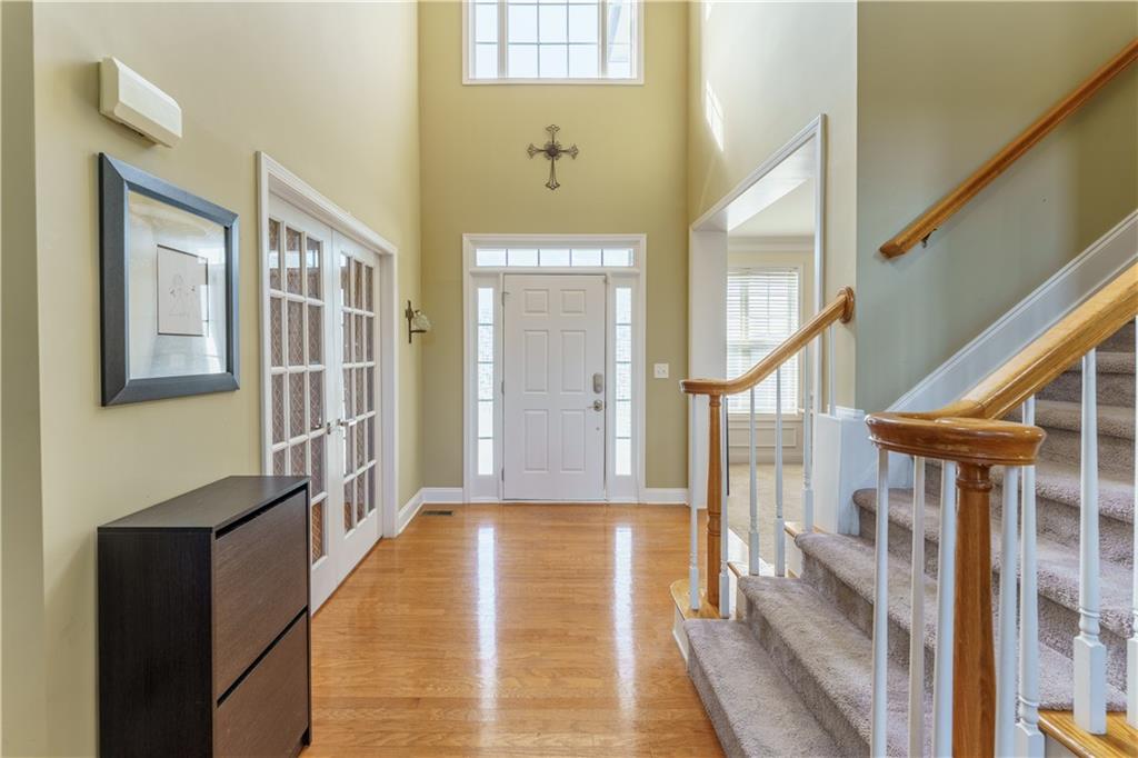 976 Redstone Road Dacula, GA 30019 - Photo 15 of 43 a view of an entryway with wooden floor and a livingroom