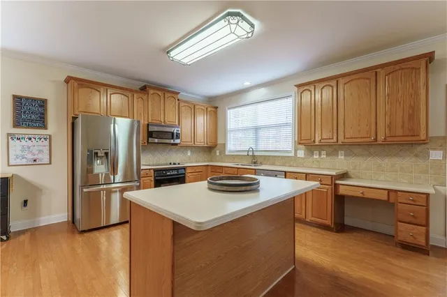 a kitchen with a stove and a microwave