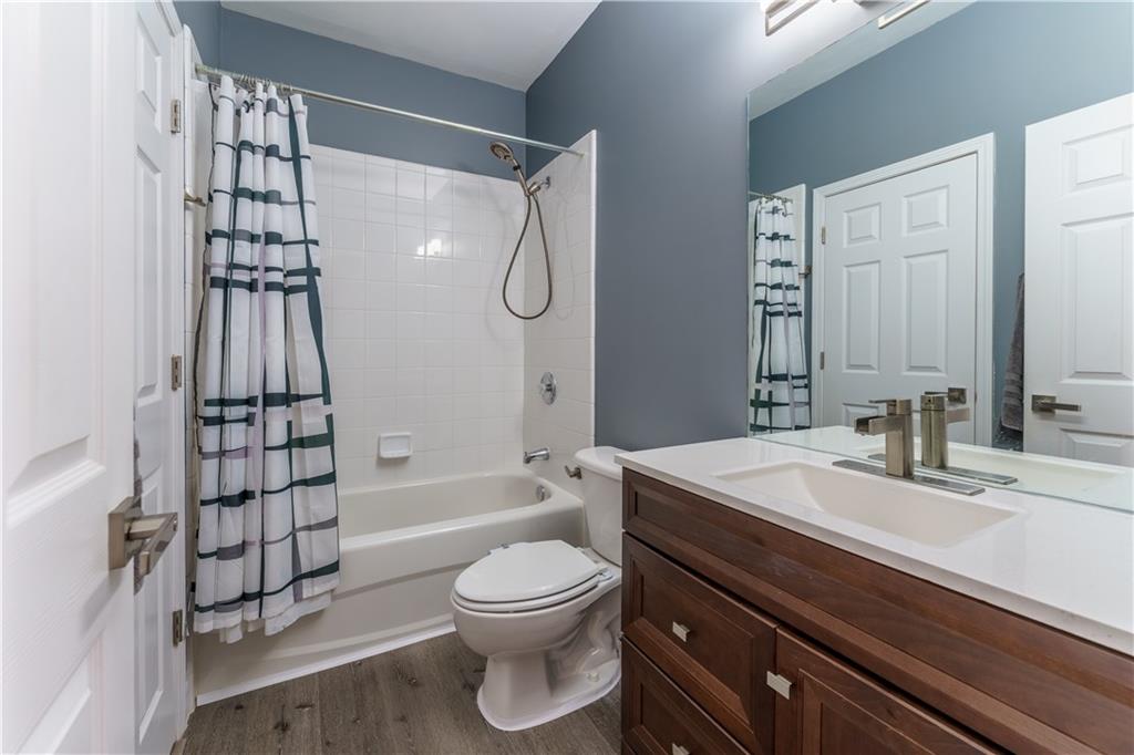 976 Redstone Road Dacula, GA 30019 - Photo 23 of 43 a bathroom with a sink a toilet and shower