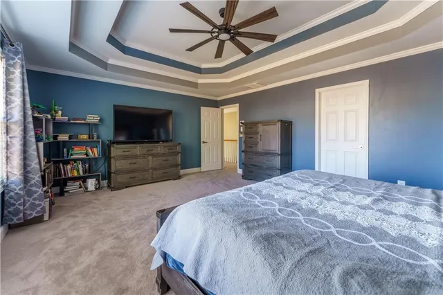 a spacious bathroom with a granite countertop sink a mirror and a bathtub