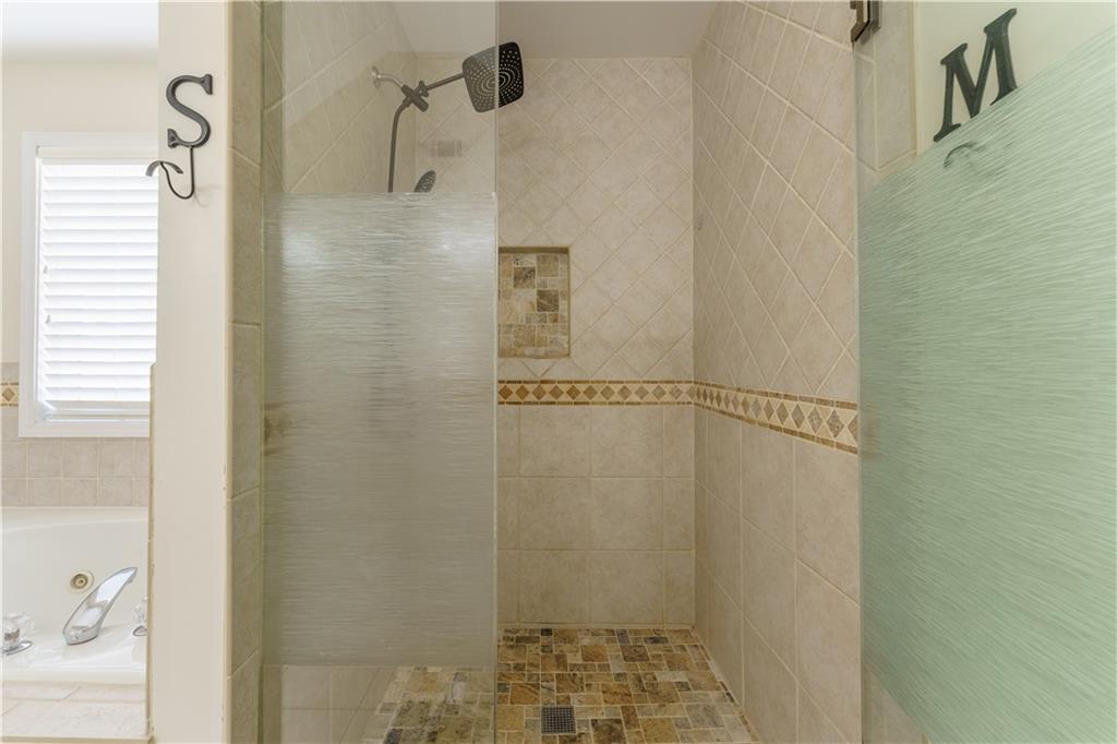 976 Redstone Road Dacula, GA 30019 - Photo 33 of 43 a bathroom with a shower