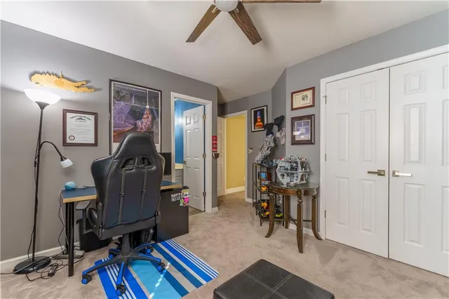 a living room with lots of furniture and a flat screen tv