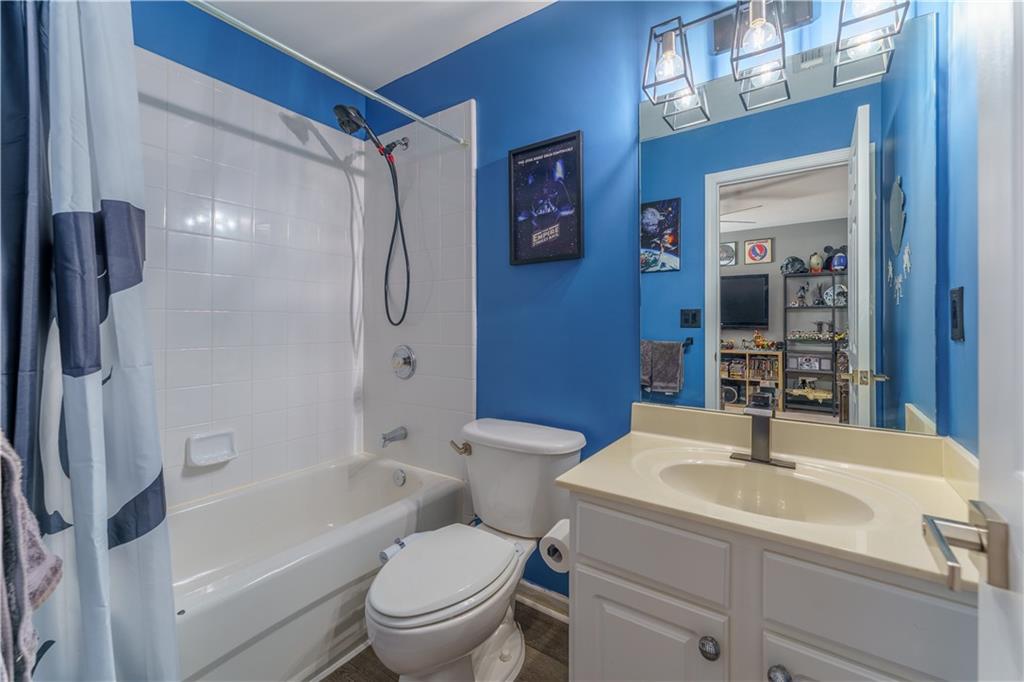 976 Redstone Road Dacula, GA 30019 - Photo 37 of 43 a bathroom with a sink toilet and shower