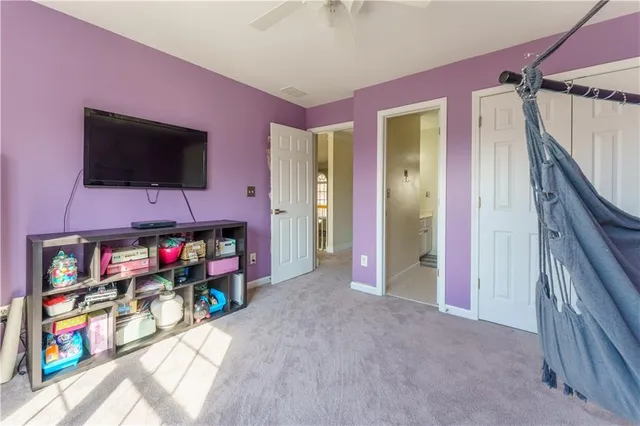 a bedroom with a bed and a mirror