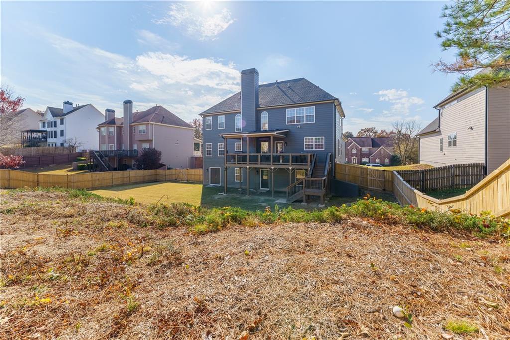 976 Redstone Road Dacula, GA 30019 - Photo 43 of 43 a view of a house with a yard and a large tree