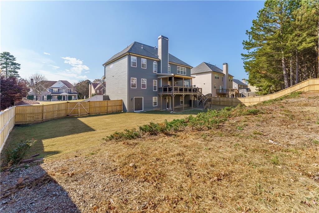 976 Redstone Road Dacula, GA 30019 - Photo 6 of 43 a view of a house with a yard