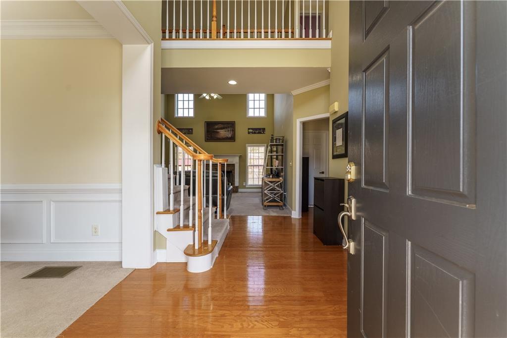 976 Redstone Road Dacula, GA 30019 - Photo 10 of 43 a hallway with a dining table and chairs