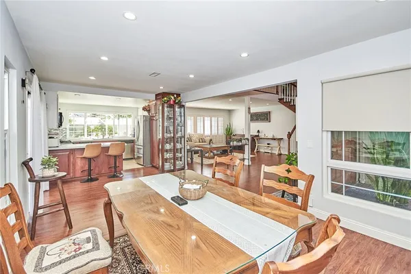 a living room with furniture a rug and white walls